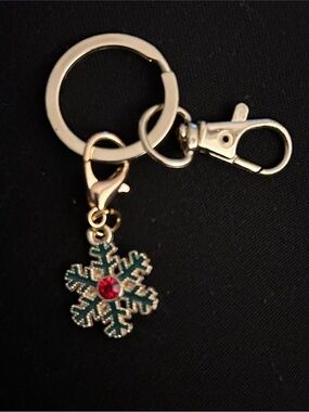 Gold Snowflake Keychain with Green Enamel and Red Crystal Accent
